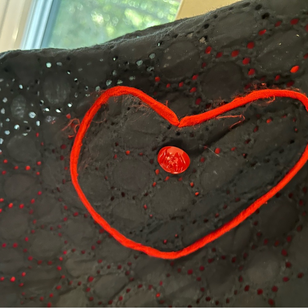 Black and red dress with heart cut outs and heart pockets. SIZE S